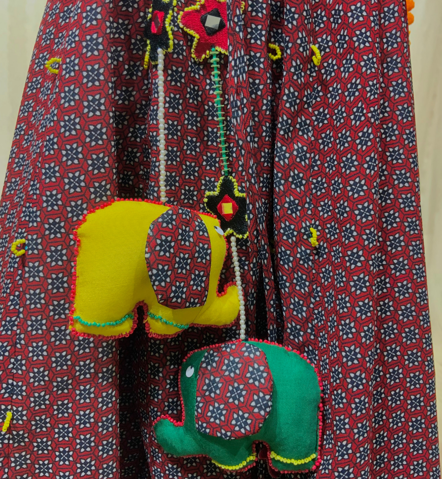 RED PRINTED LEHENGA SET WITH ELEPHANT TASSELS